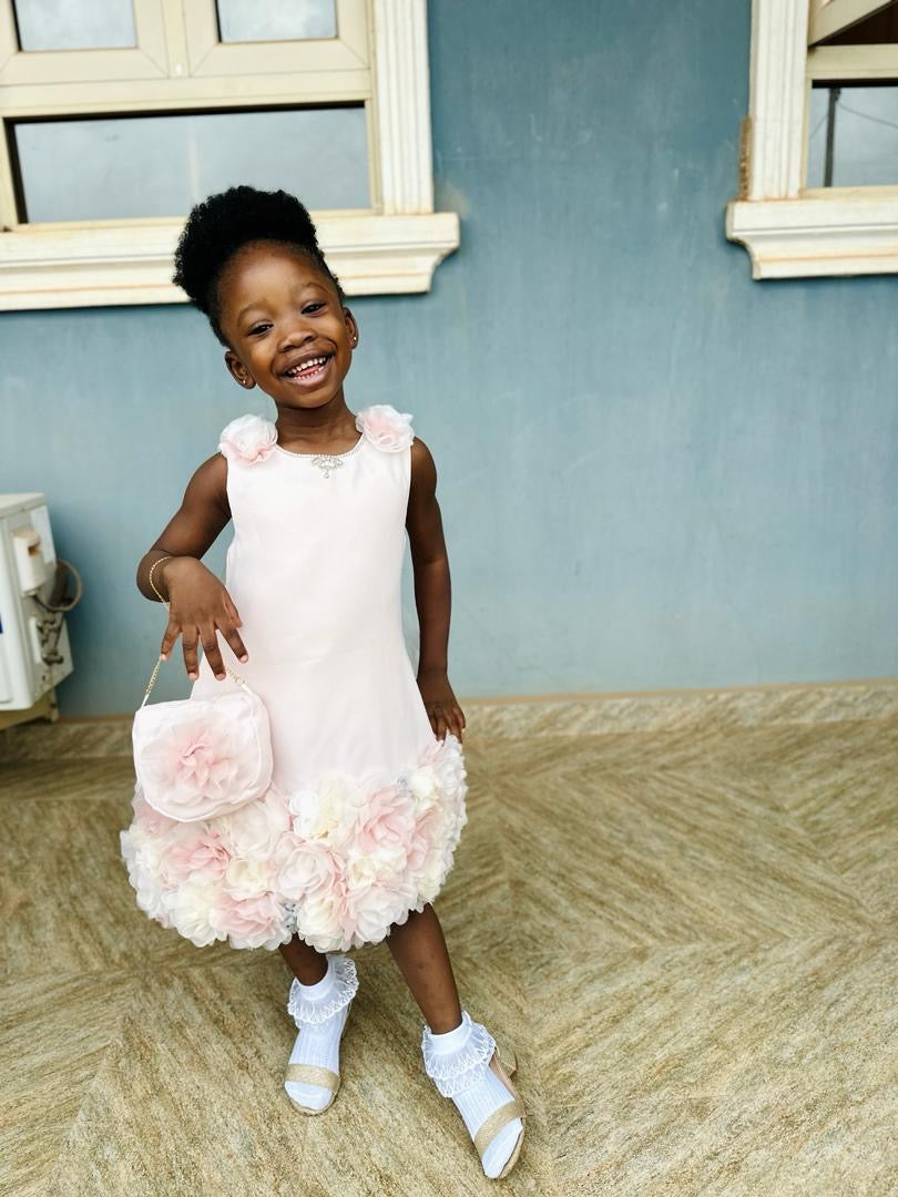 Little Girl’s Sleeveless Dress with handmade ruffled petals